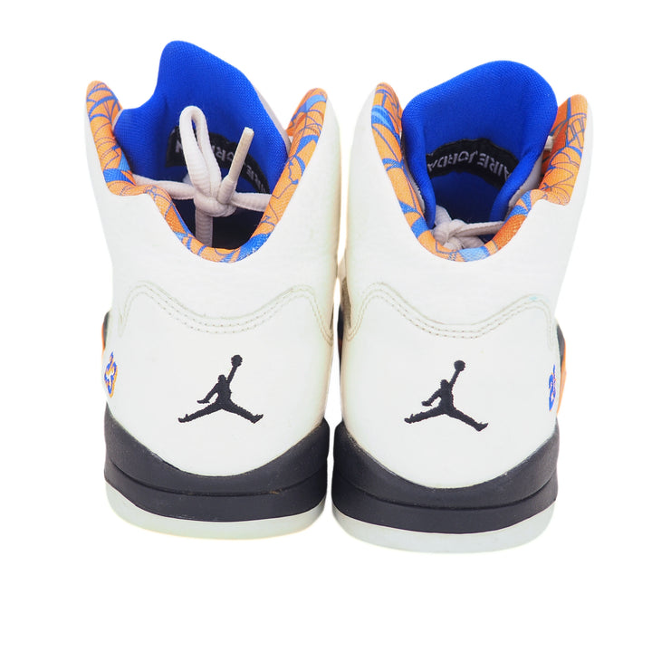 Pair of Jordan sneakers with white, blue, and orange design on a white background
