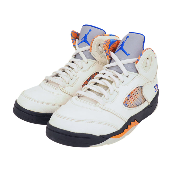 White Jordan V sneakers with orange and blue accents on a white background