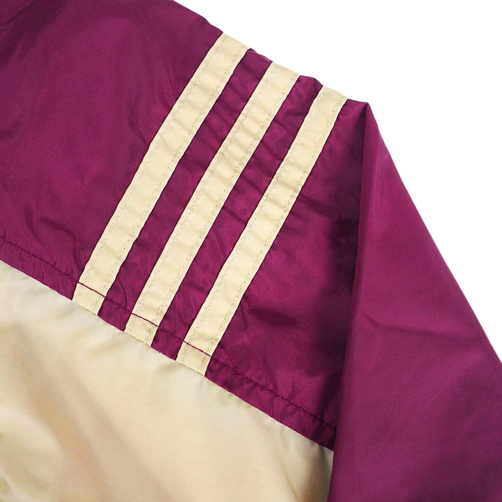 Adidas three stripes on the shoulder of a vintage anorak jacket in gold and burgundy