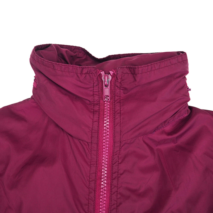 Close-up of a burgundy jacket collar with a zipper on a white background