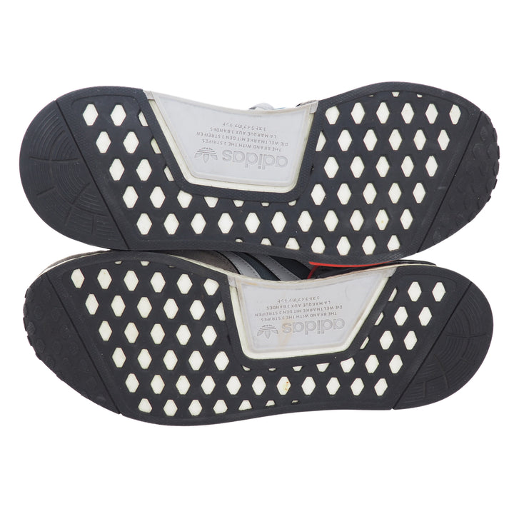 Black and white sneaker sole with Adidas logo on a white background
