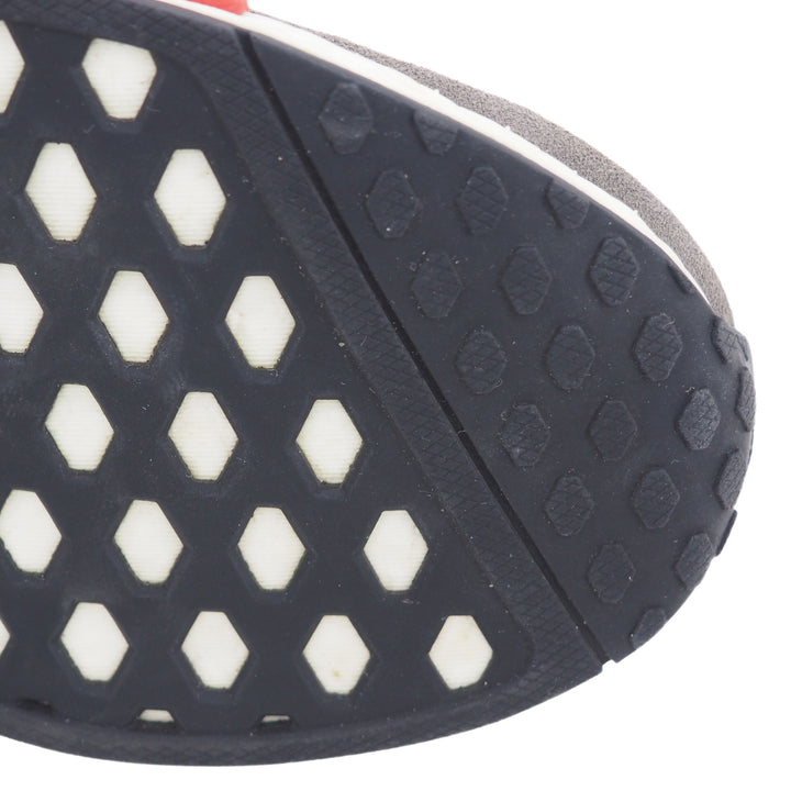Close-up of a shoe sole with hexagonal pattern and tread design.