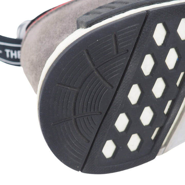 Close-up of a shoe sole heel with a textured pattern on a white background