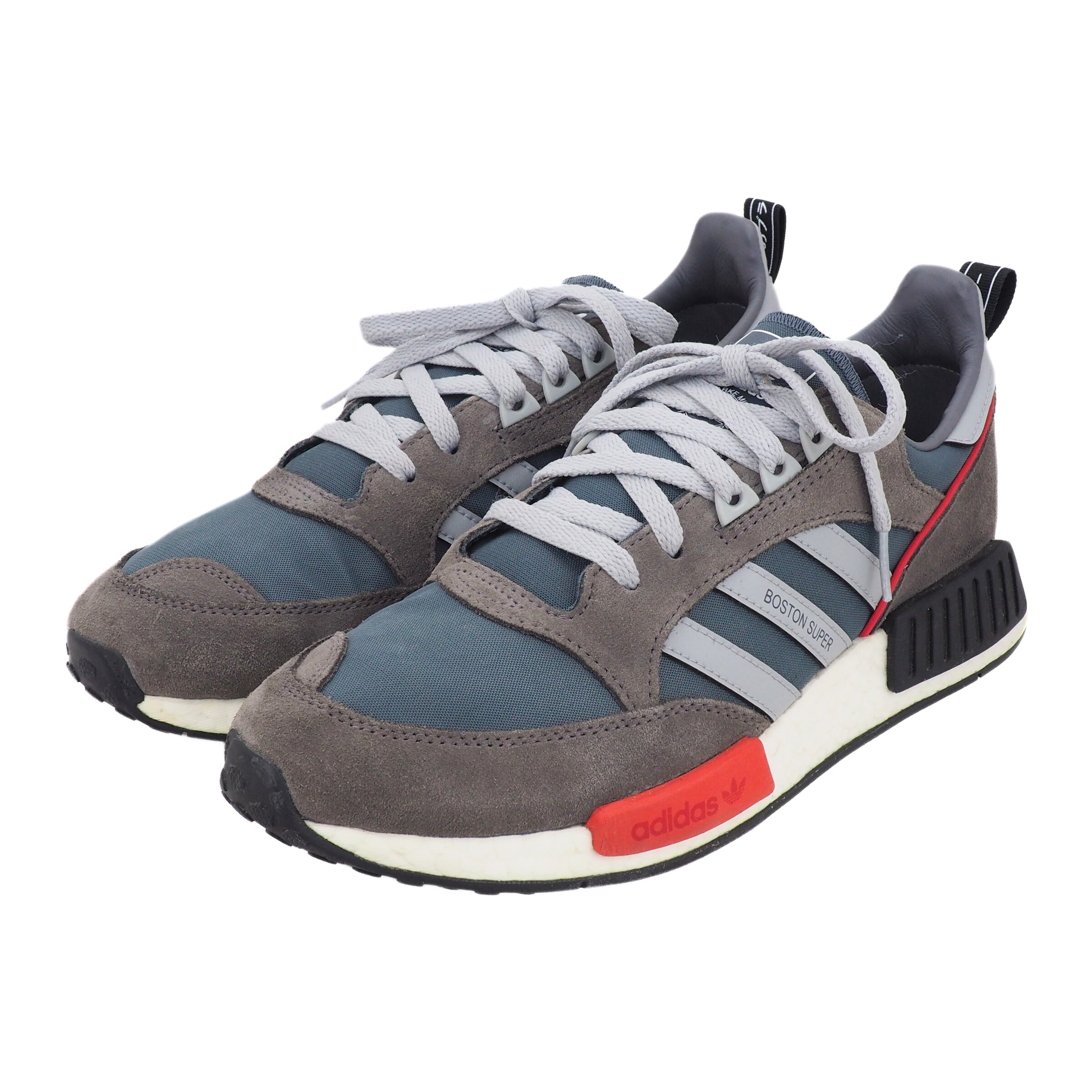 Gray and blue adidas sneakers with gray laces and red accents on a white background