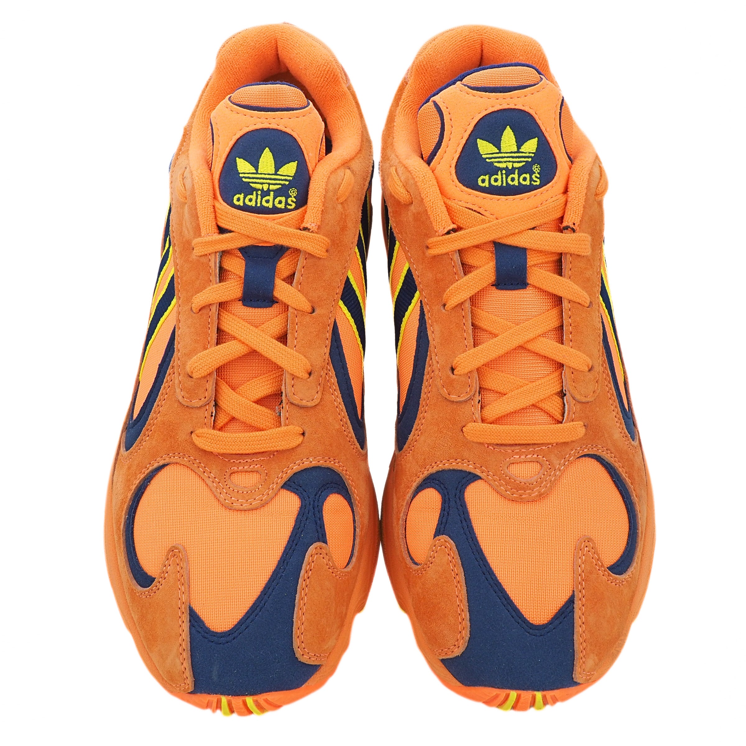 Orange and blue Adidas sneakers on a white background