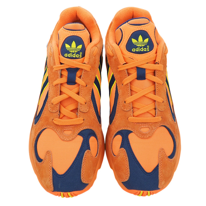 Orange and blue Adidas sneakers on a white background