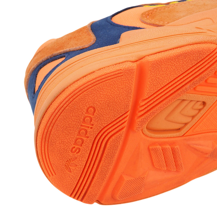Close-up of an Adidas shoe sole with orange and blue design