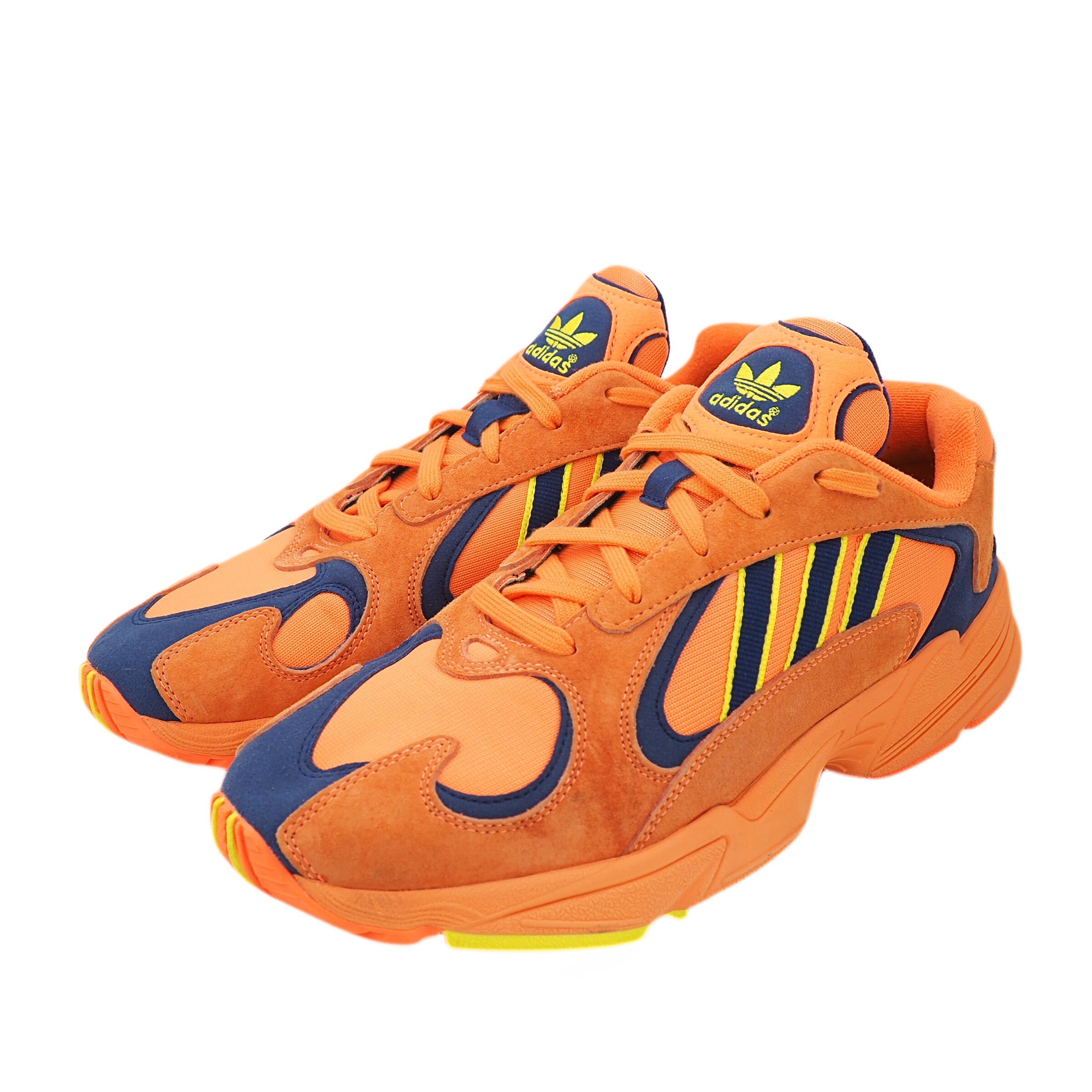 Orange and blue Adidas Yung-1 sneakers on a white background