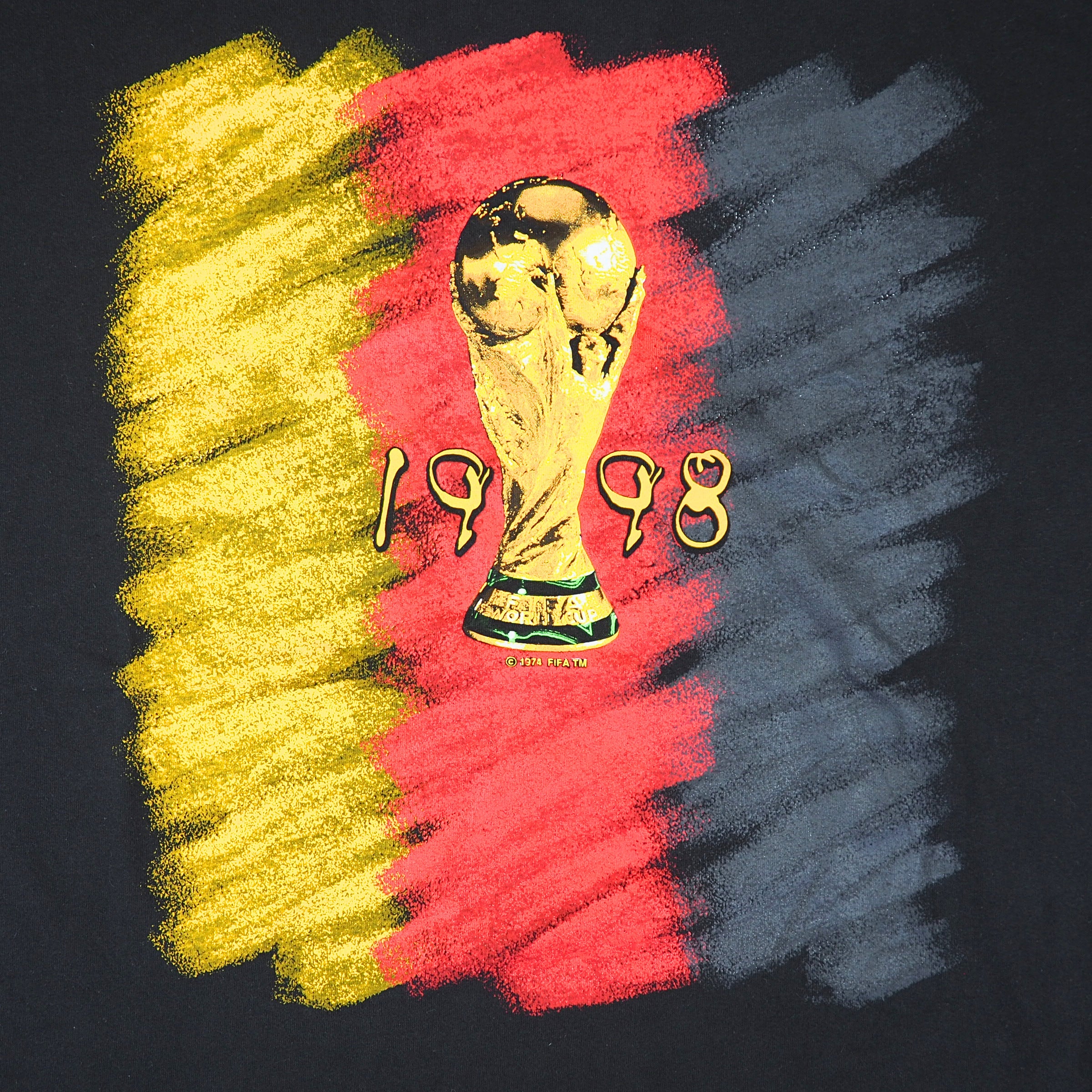 Close up of a t-shirt graphic of the german flag and the world cup trophy from 1998