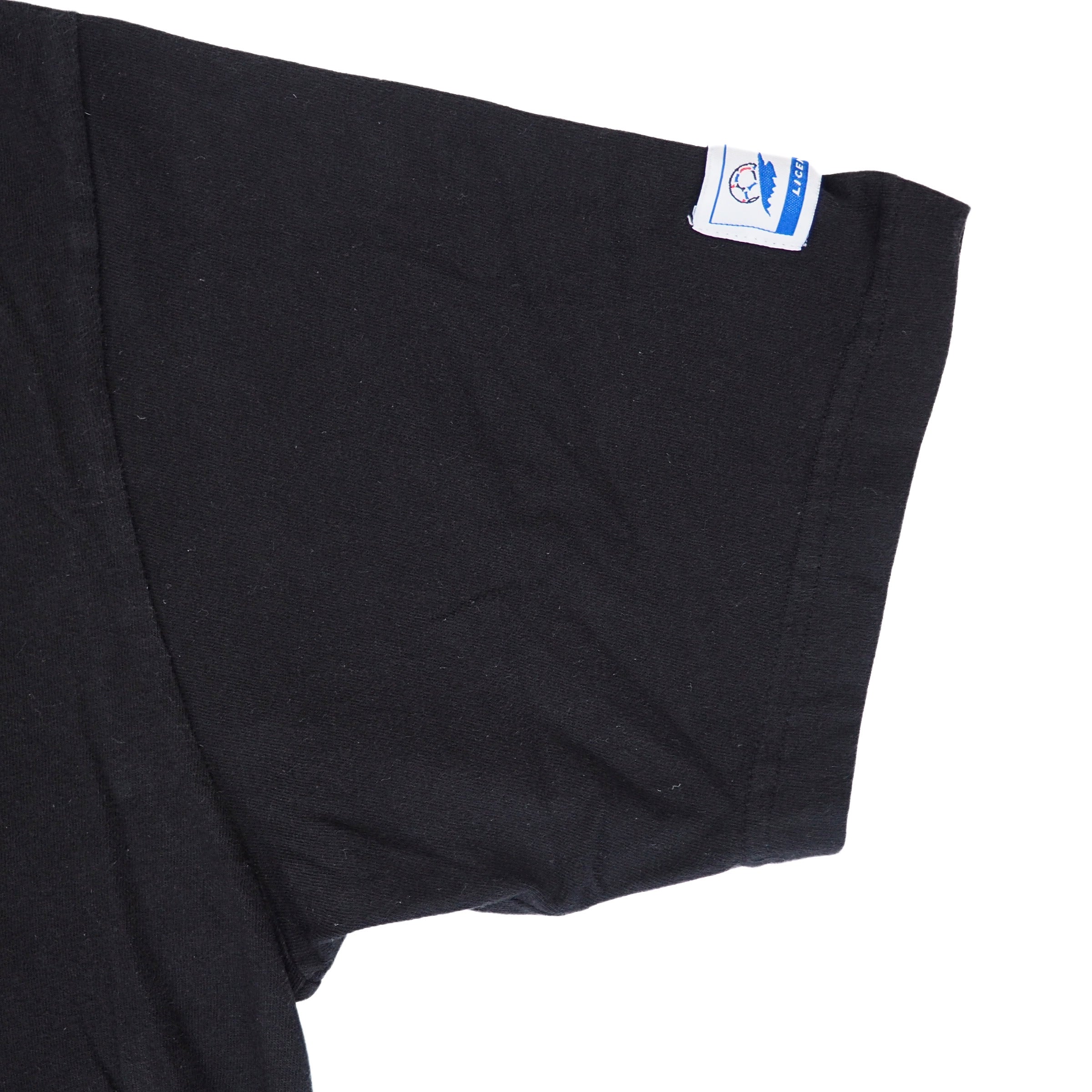 Close up of a black t-shirt sleeve on a white background