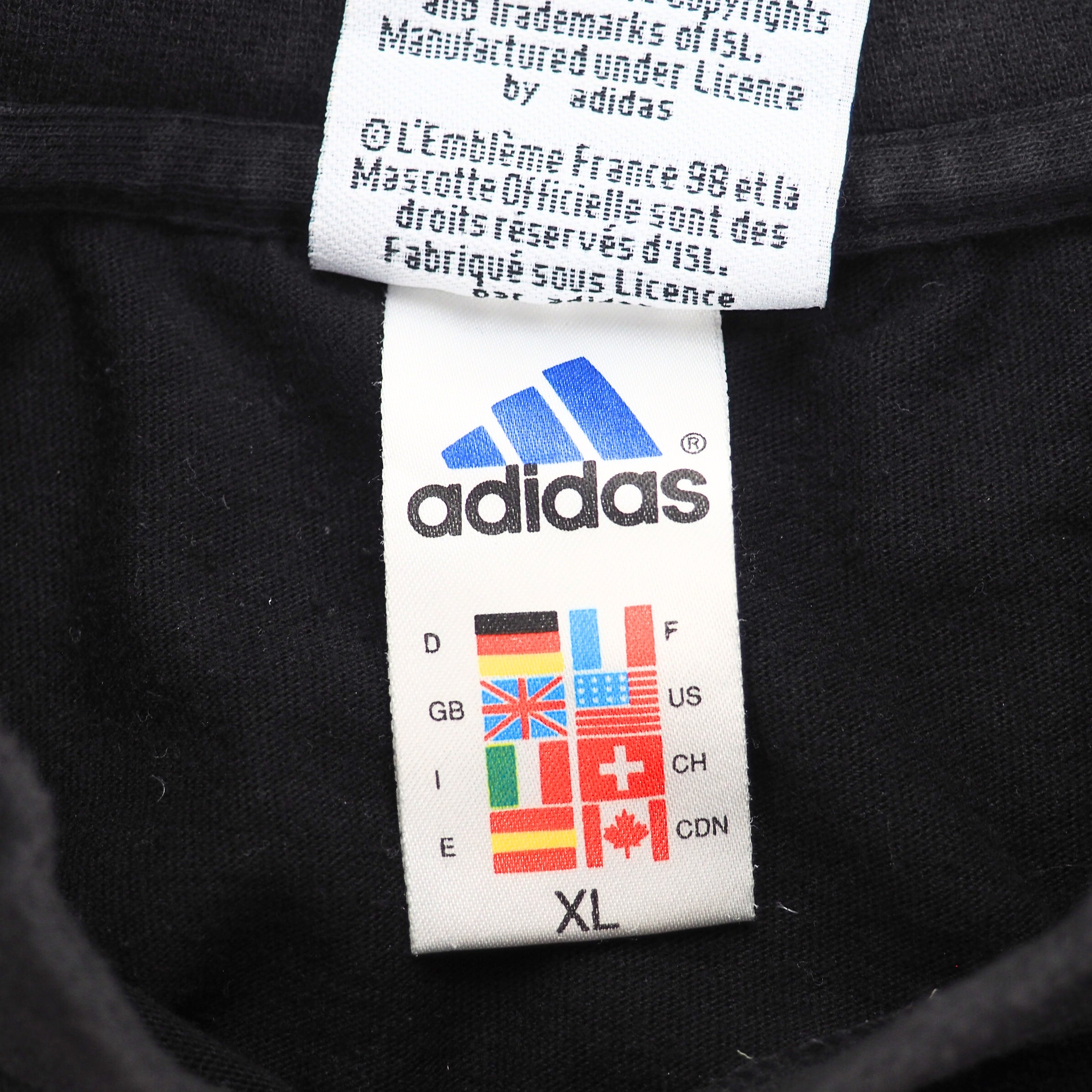 Close up of a 1990s adidas flag tag
