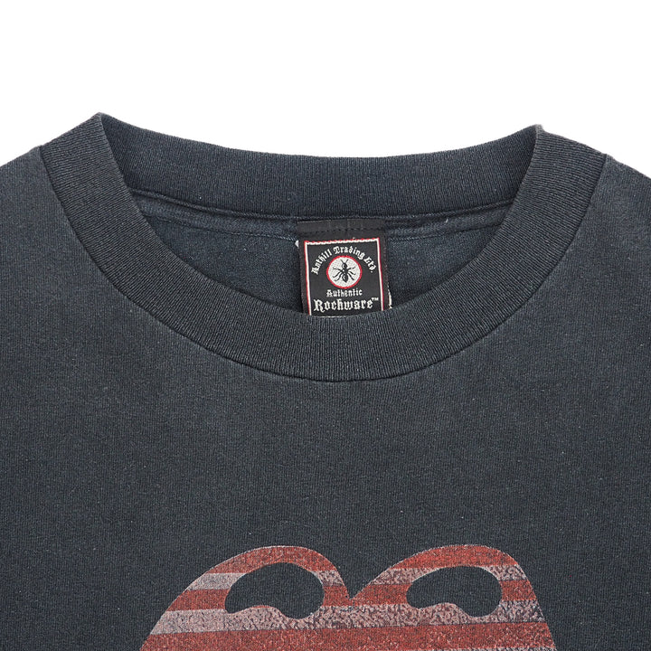 Close up of the collar of a faded black vintage t-shirt with brand label on a white background