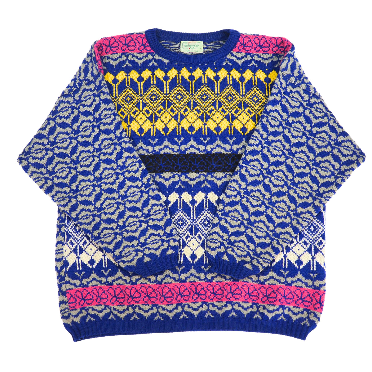 A multicolor knit crewneck sweater with a complex geometric and tribal pattern. The base color is royal blue, decorated with yellow, cream, and hot pink patterned bands across the chest and shoulders, set against a plain white background.