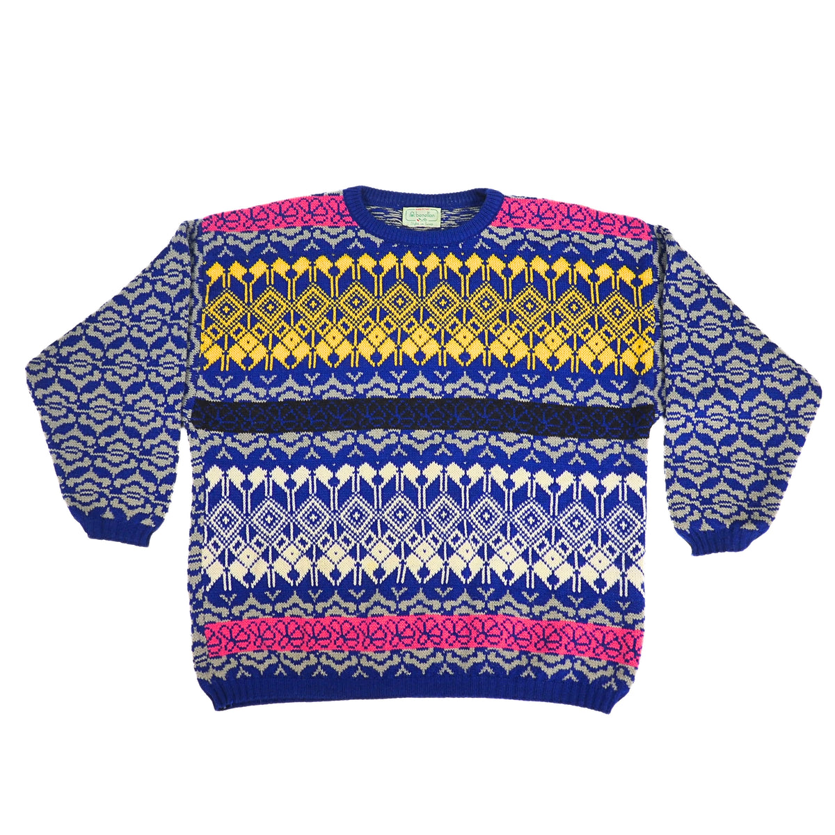A multicolor knit crewneck sweater with a complex geometric and tribal pattern. The base color is royal blue, decorated with yellow, cream, and hot pink patterned bands across the chest and shoulders, set against a plain white background.