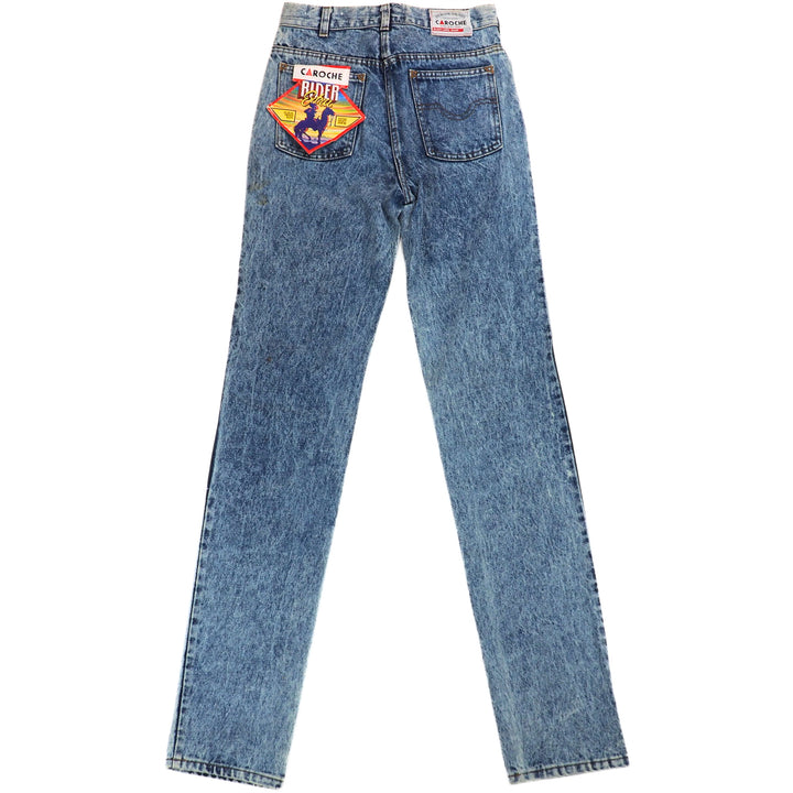 Back view of a pair of blue jeans with retail card branding on the back pocket on a white background