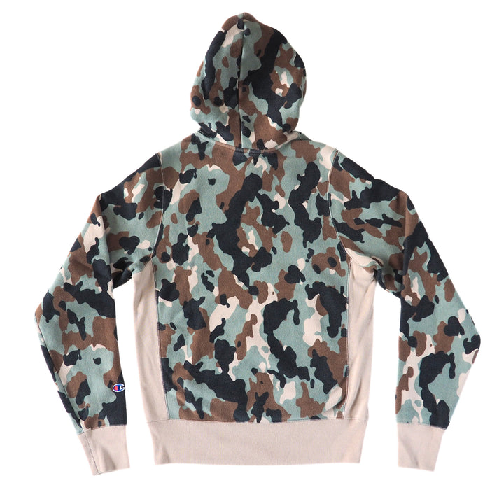 Back view of a camouflage hoodie with cream coloured trim on a white background