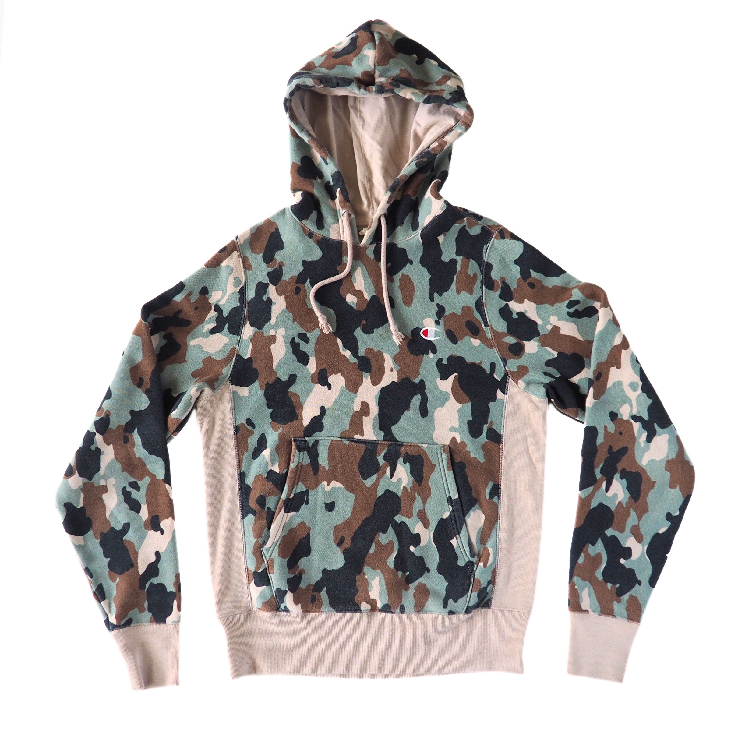 Camouflage Champion hoodie with a cream colored interior and trim on a white background