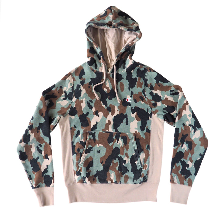 Camouflage Champion hoodie with a cream colored interior and trim on a white background
