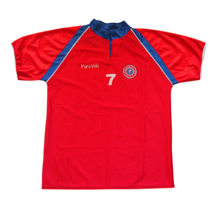 Red Costa Rica soccer jersey with blue accents and 'Pura Vida' branding on a white background