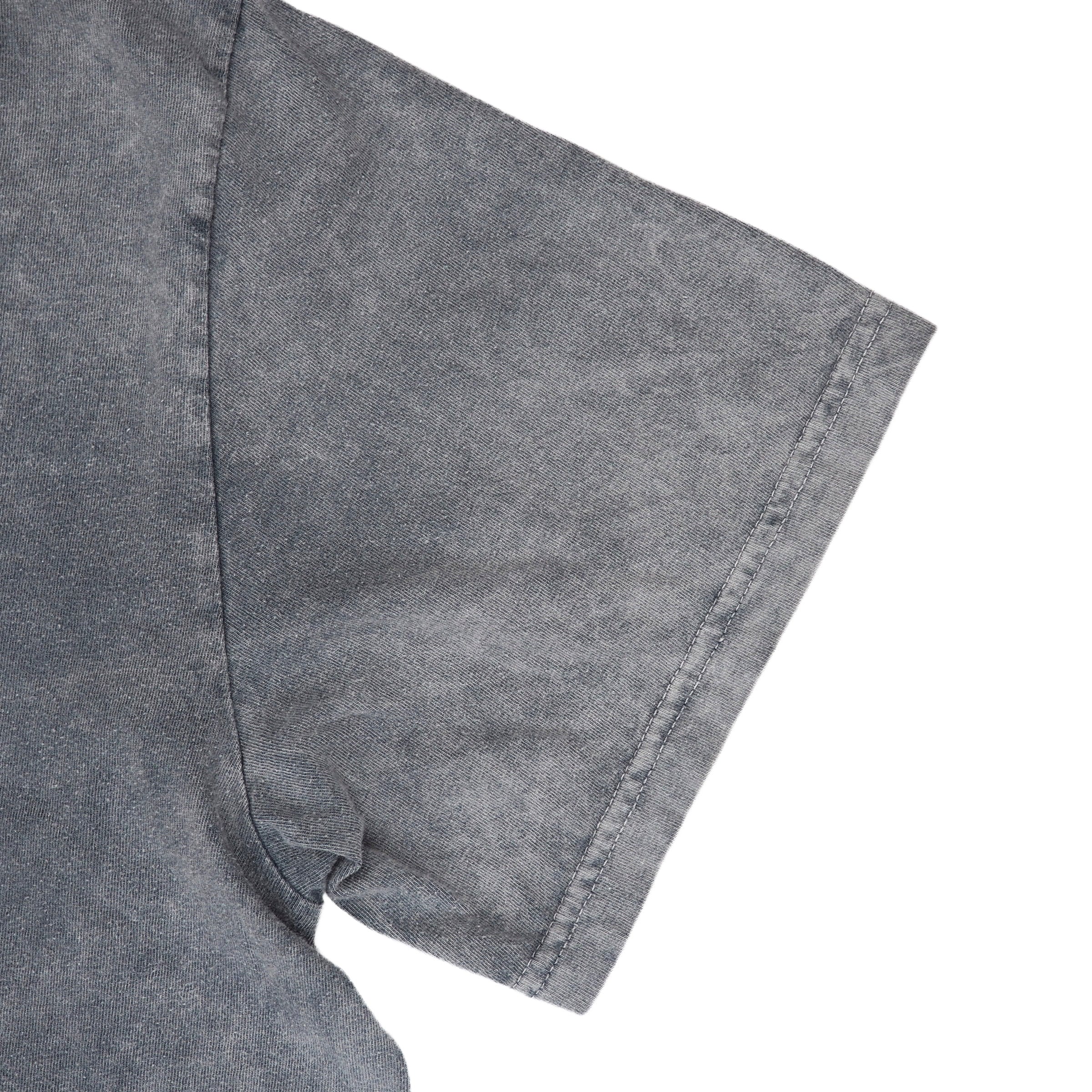 Close-up of a gray short-sleeve shirt sleeve with a washed, textured finish on a white background.
