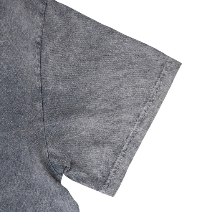 Close-up of a gray short-sleeve shirt sleeve with a washed, textured finish on a white background.