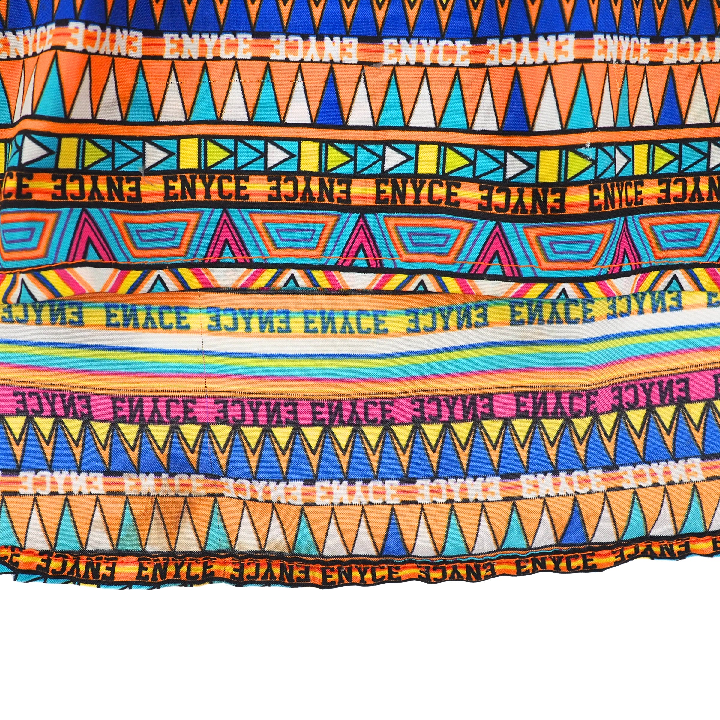 Detail of colorful patterned fabric with ENYCE branding
