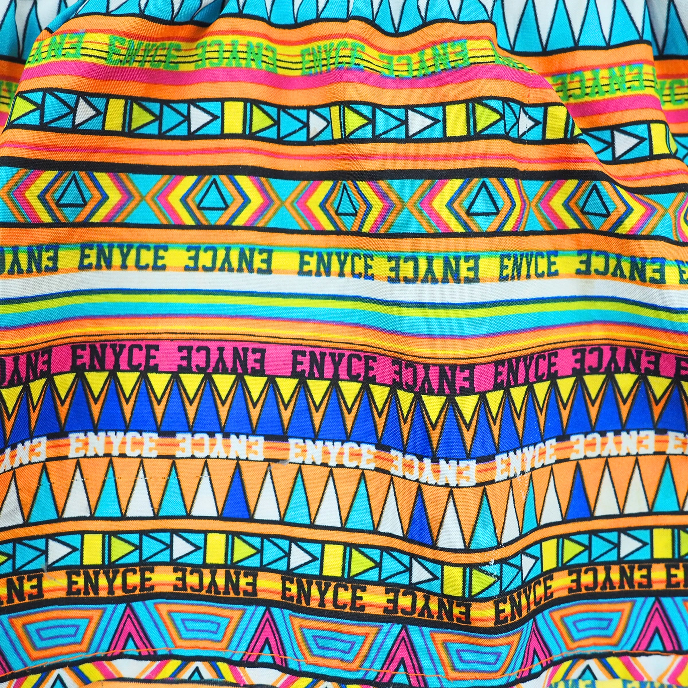 Colorful patterned fabric with 'ENYCE' branding