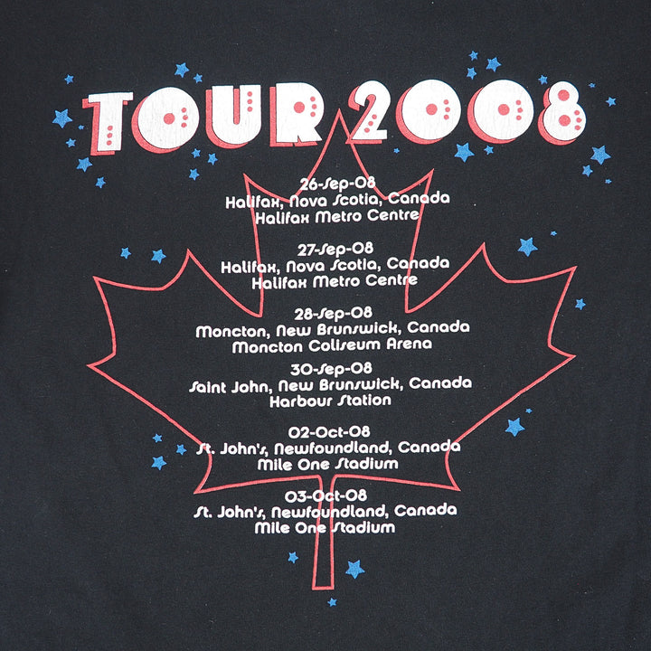 A close-up of a black graphic print featuring a red outlined maple leaf with the text 'TOUR 2008' in large white letters with red outlines, surrounded by small blue stars and a list of tour dates in white text.