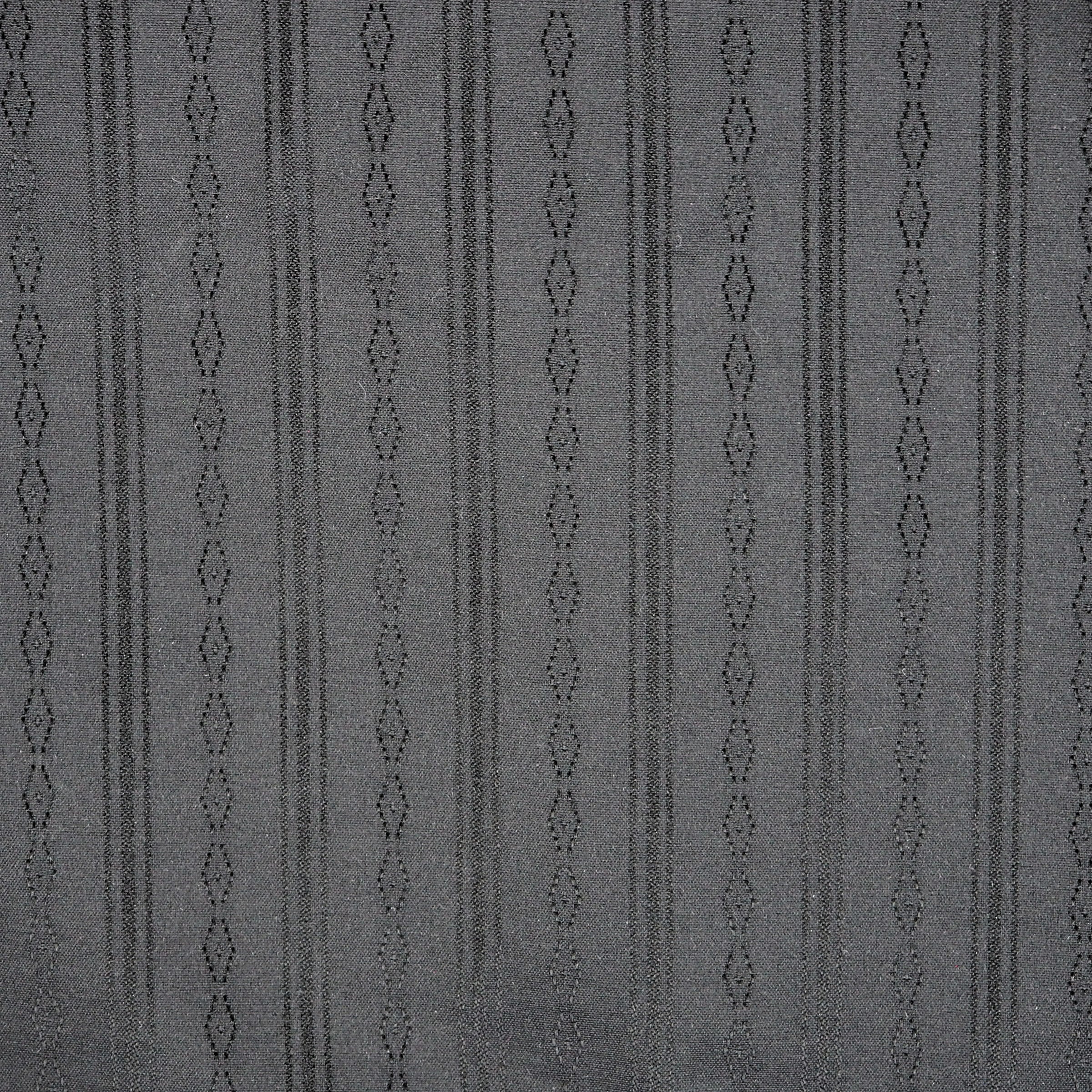 Detail of the woven pattern of a black shirt.