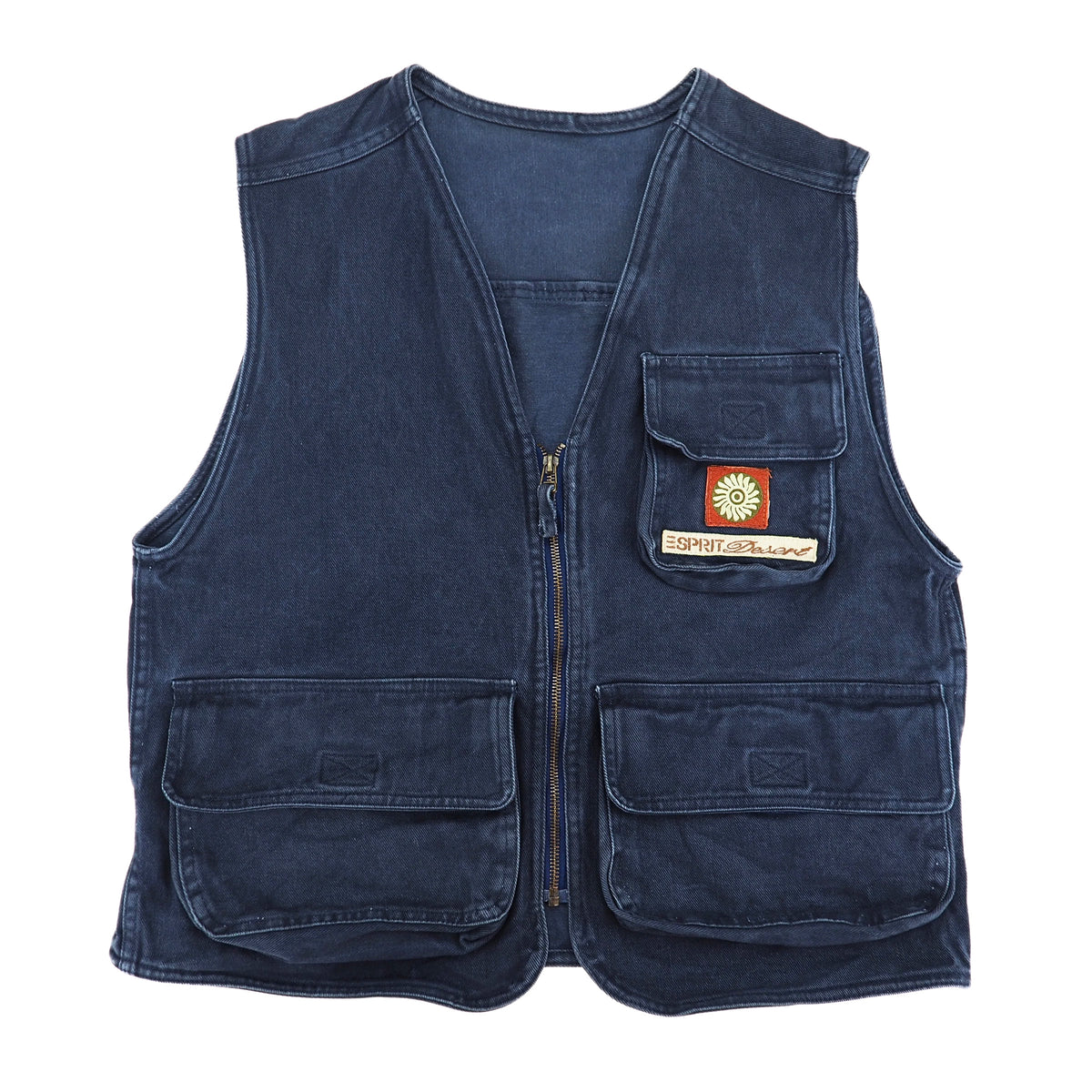 A dark blue denim utility vest with multiple front pockets, a central zipper, and a small 'Esprit Desert' patch on the chest pocket, shown against a plain white background.