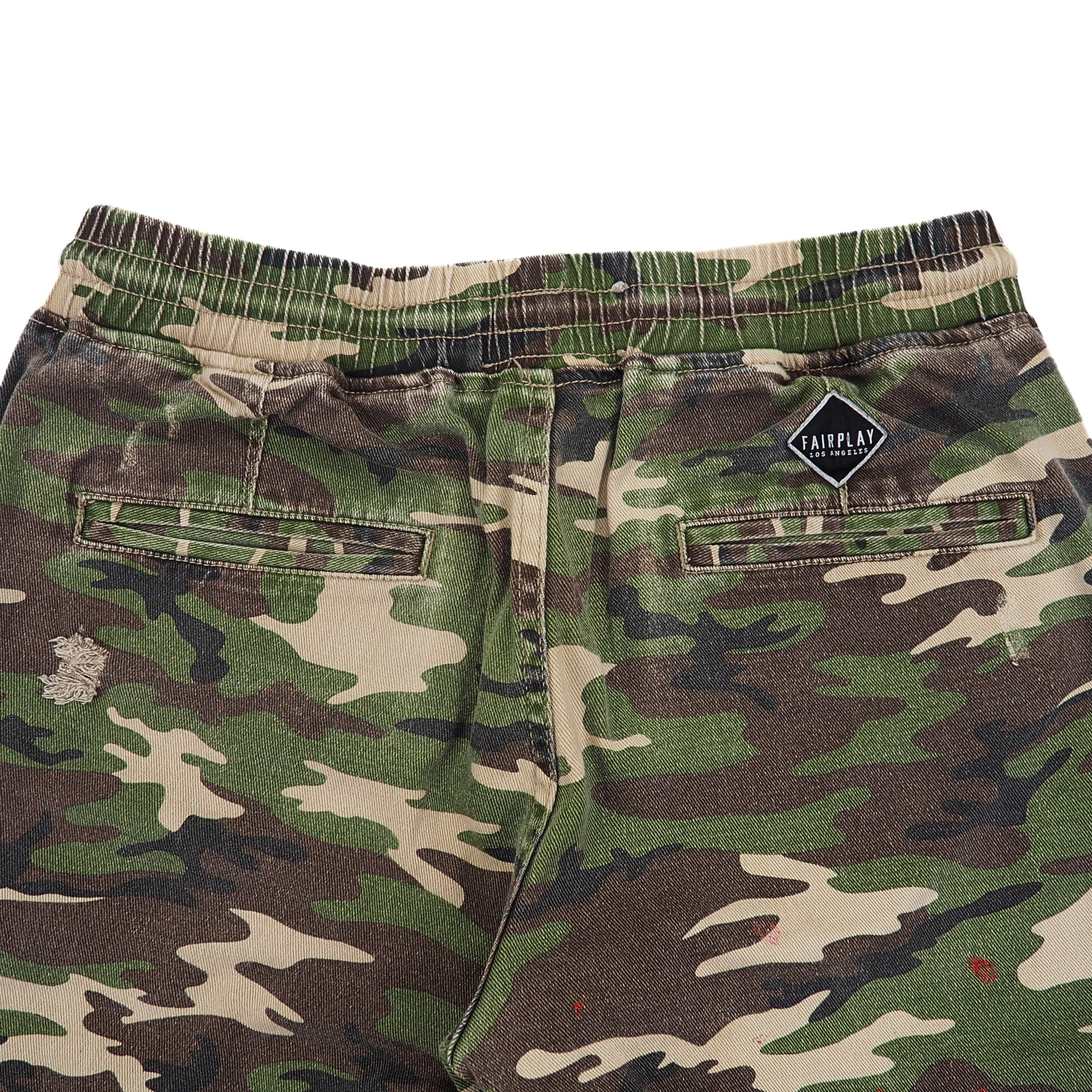 Camouflage shorts with a visible brand logo on a white background
