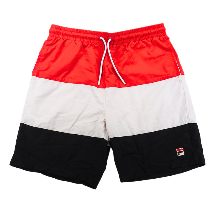 Color-blocked shorts with red, white, and black sections on a white background