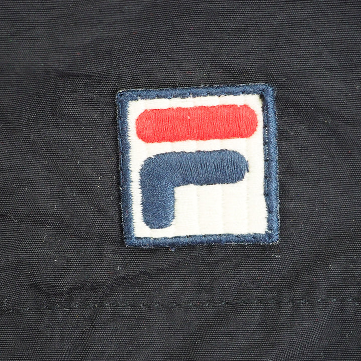 Close-up of a logo on a dark fabric background