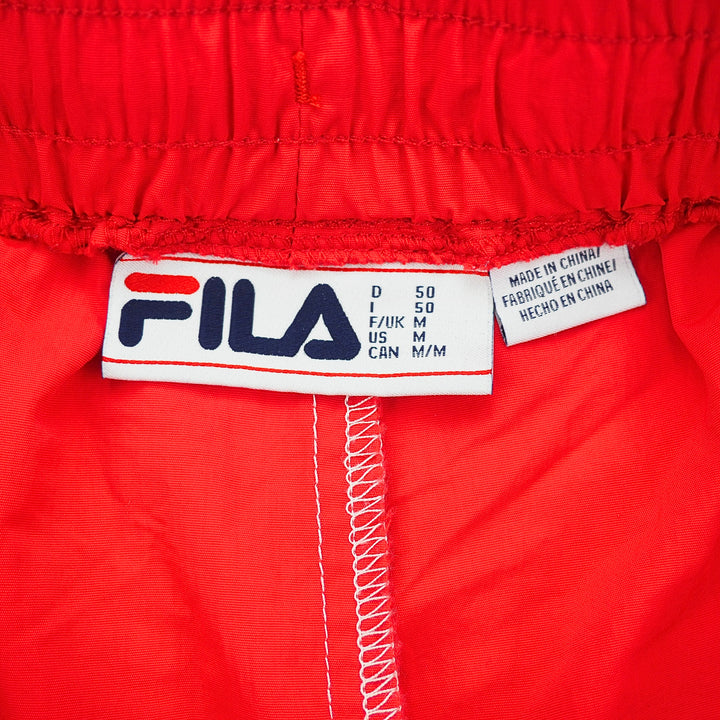 Fila label on a red jacket with size information