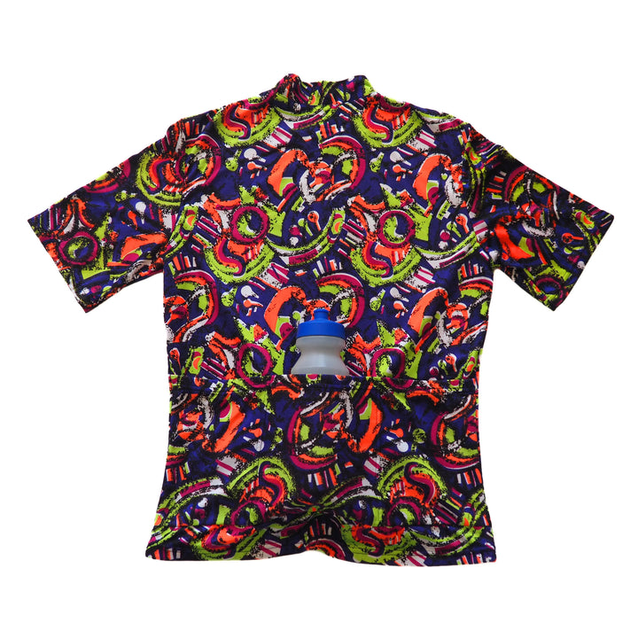 Back view of a colorful patterned cycling jersey with a water bottle tucked into a pocket on a white background