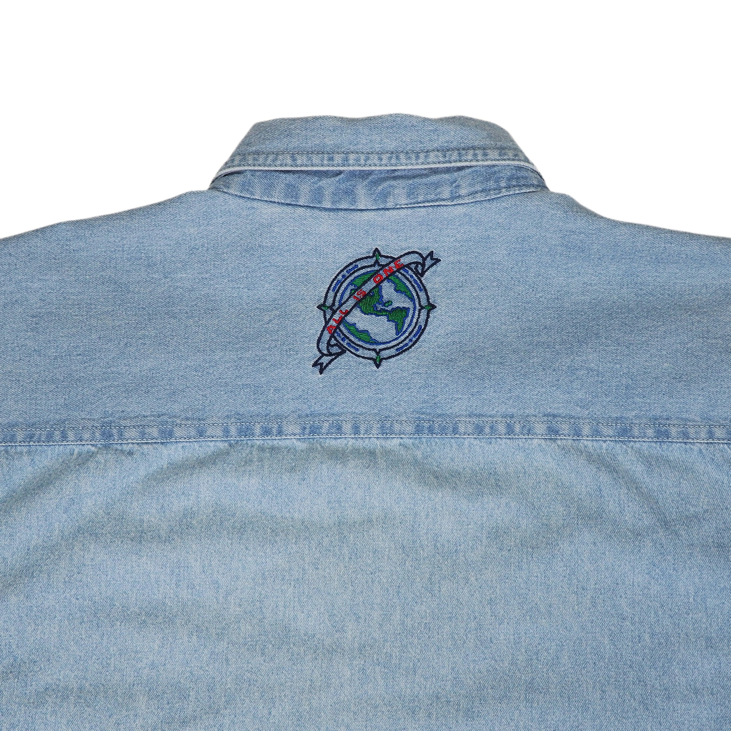 Light blue denim shirt with Hard Rock Cafe 'All Is One' globe logo on the back against a white background