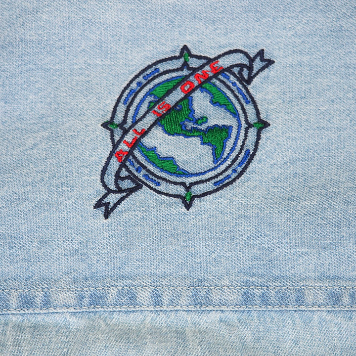 Embroidered design for Hard Rock Cafe on denim fabric with 'All is One' text and world map.