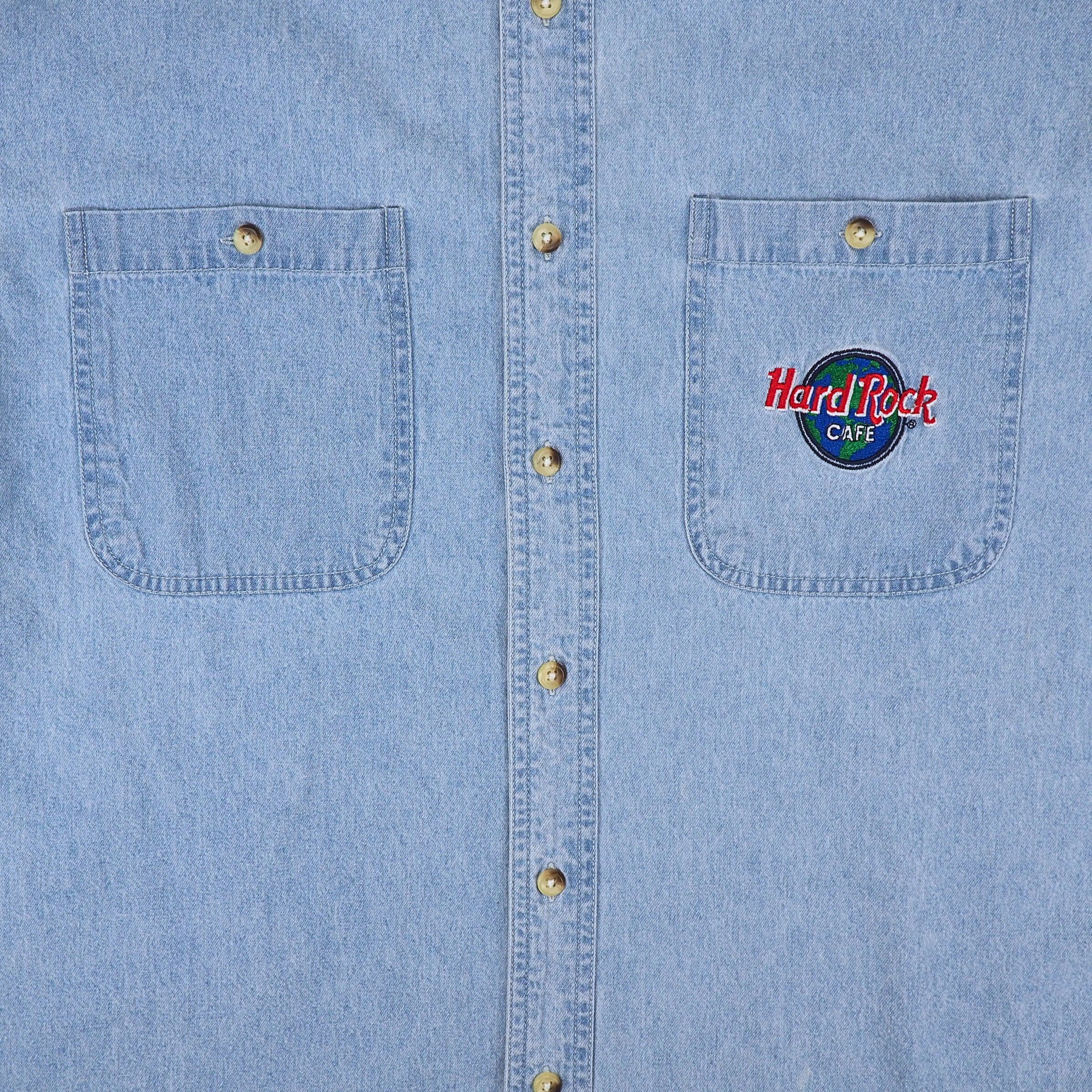 Blue denim shirt with embroidered Hard Rock Cafe logo on the left chest pocket.