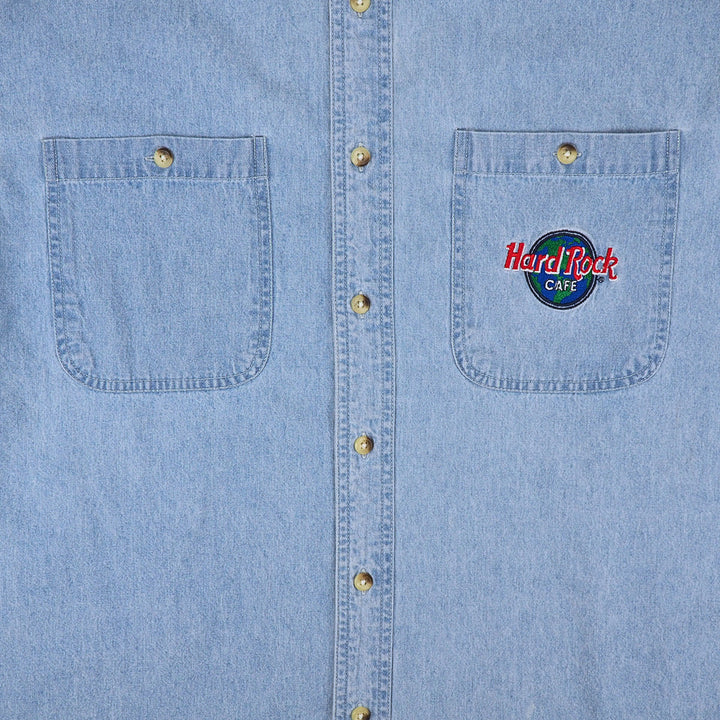 Blue denim shirt with embroidered Hard Rock Cafe logo on the left chest pocket.