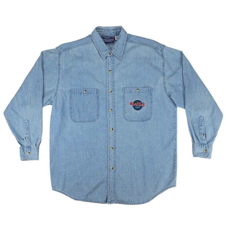 Light blue denim shirt with Hard Rock Cafe logo on breast pocket on a white background