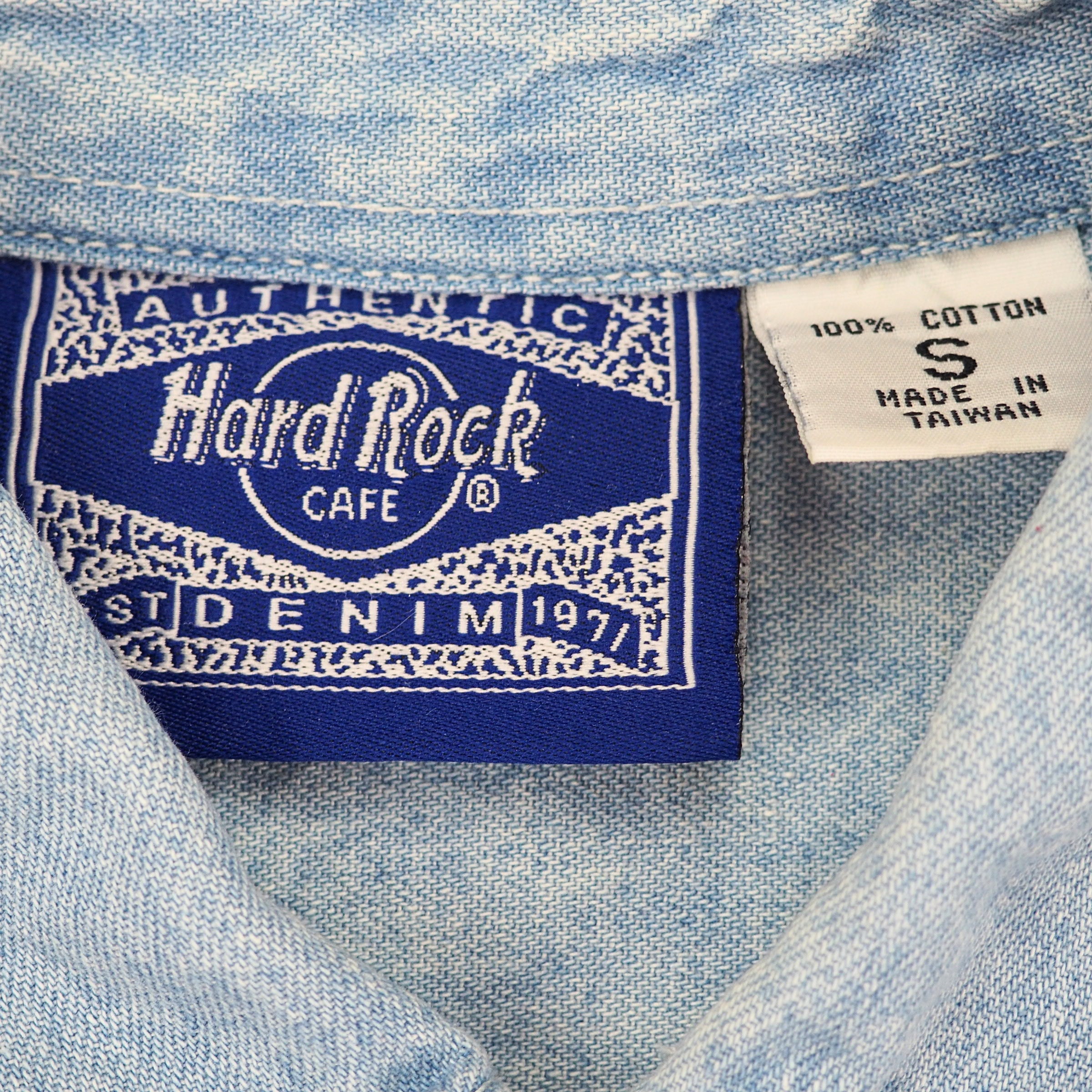 Label with Hard Rock Cafe branding on a denim fabric background