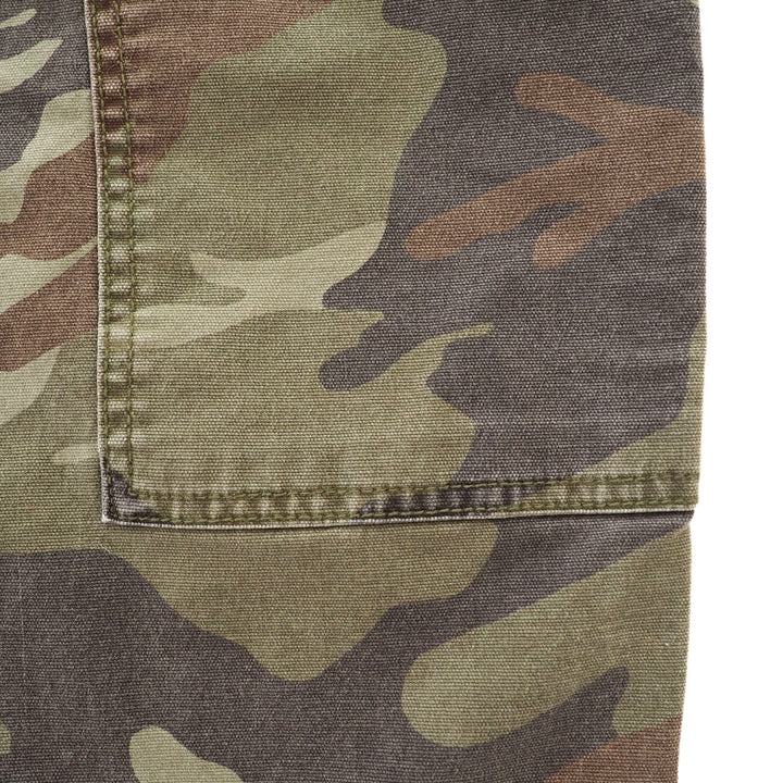 Close up of the eams and stitching details on a pair of camo cargo pants