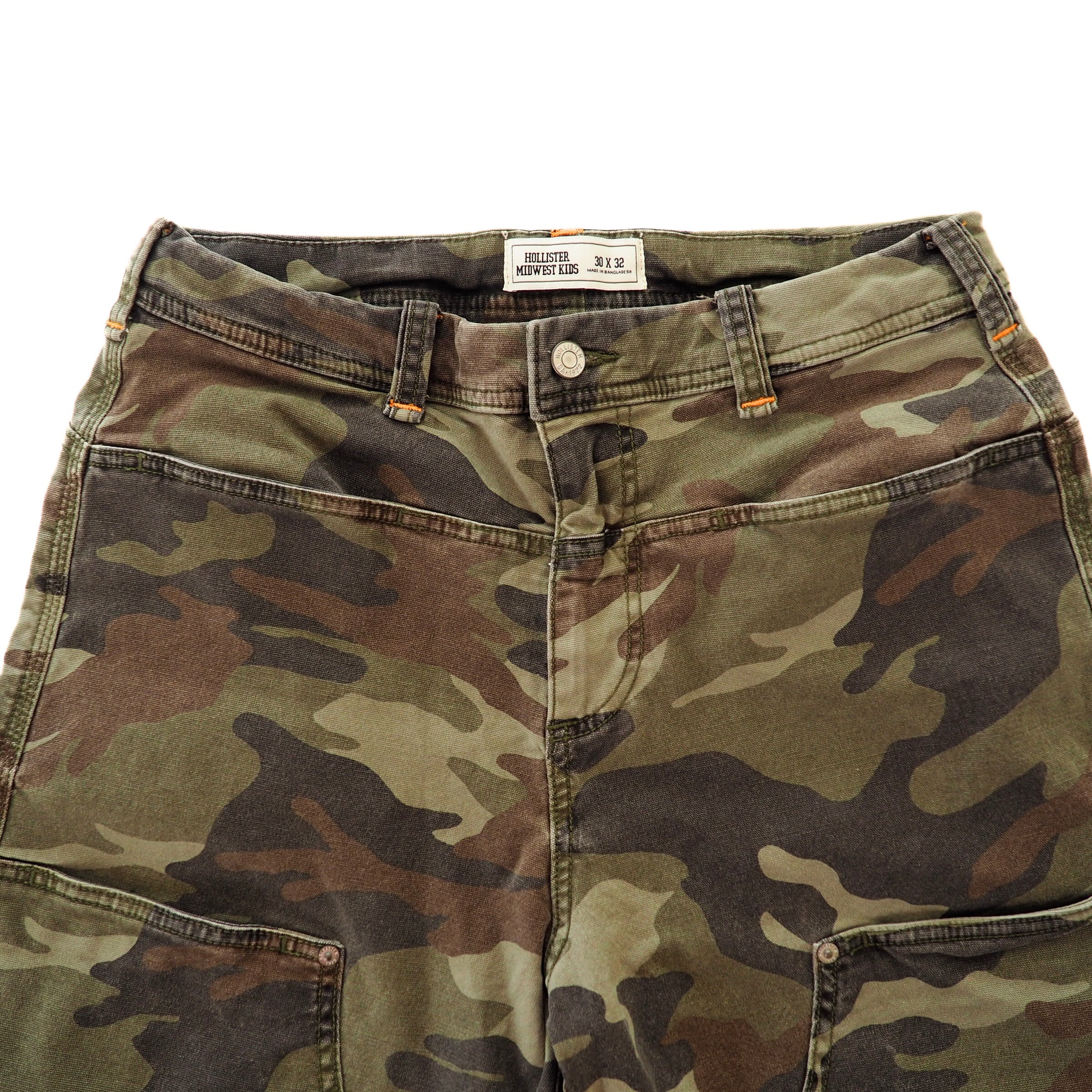 Front waist area of a pair of camouflage cargo pants