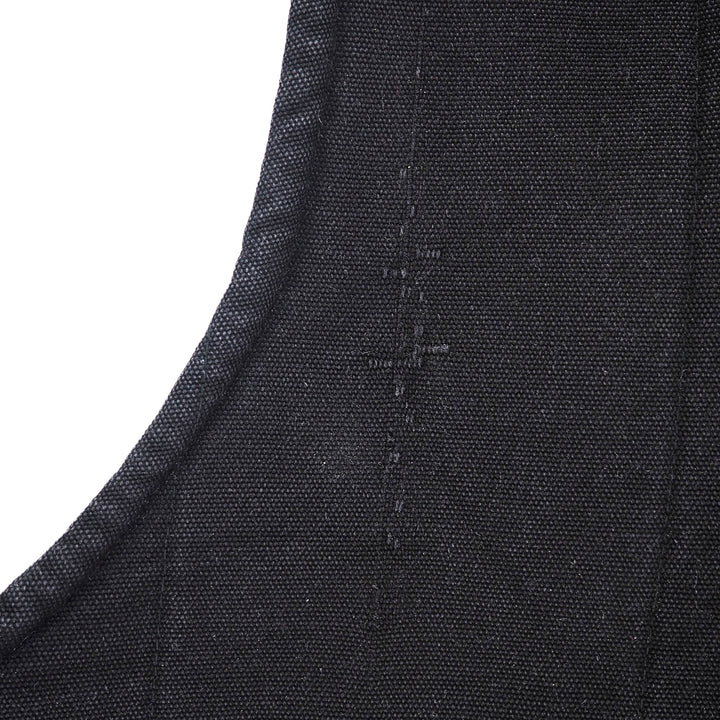 Close-up of a dark charcoal gray woven fabric with a curved seam and visible stitching, set against a plain white background.