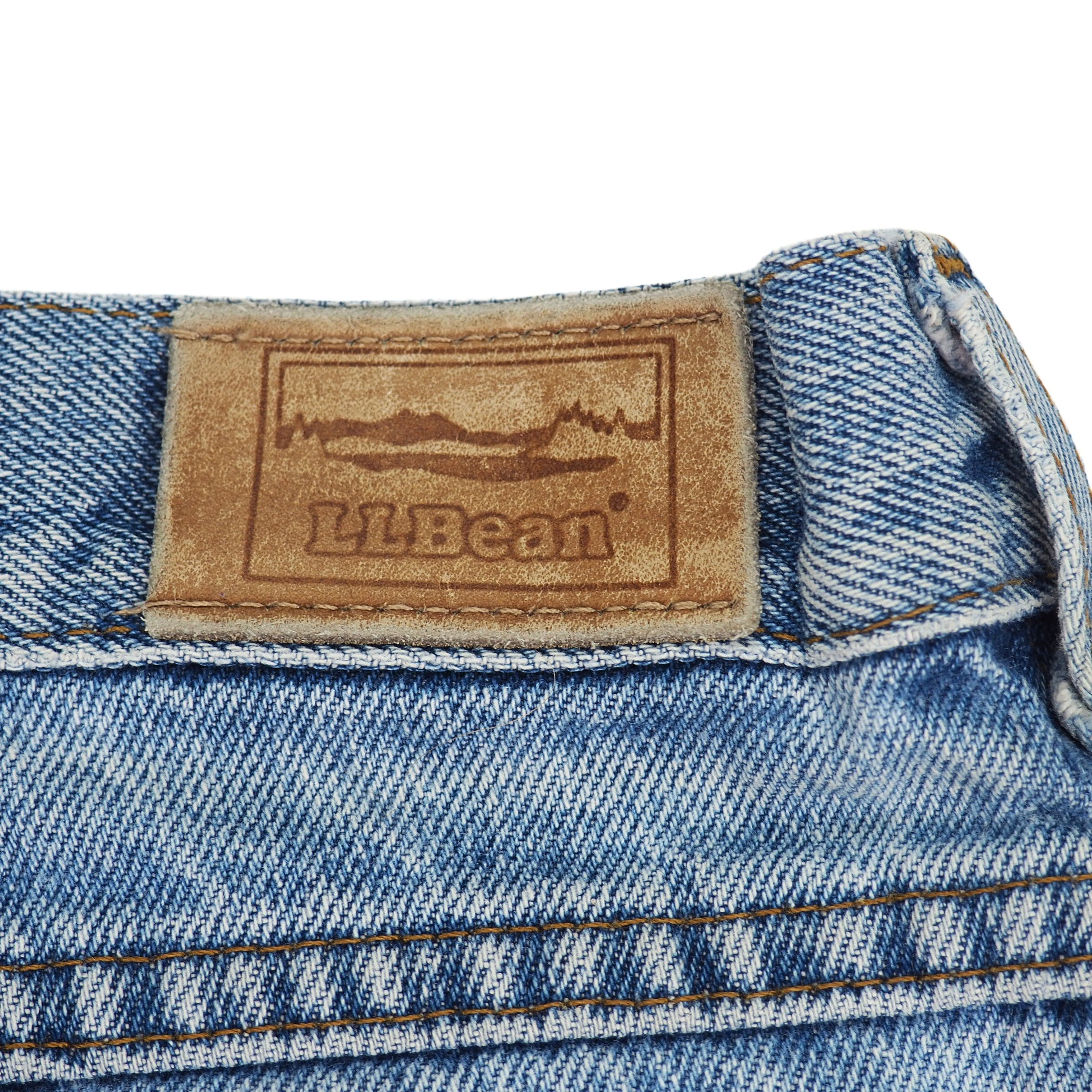 Close-up of an LL Bean jarcon patch label on the waistband of a pair of blue denim jeans