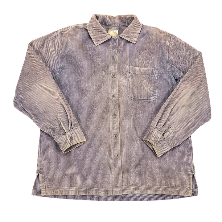 A long-sleeve button-up shirt in a faded purple corduroy fabric, featuring a chest pocket and button-down cuffs, laid flat against a white background.