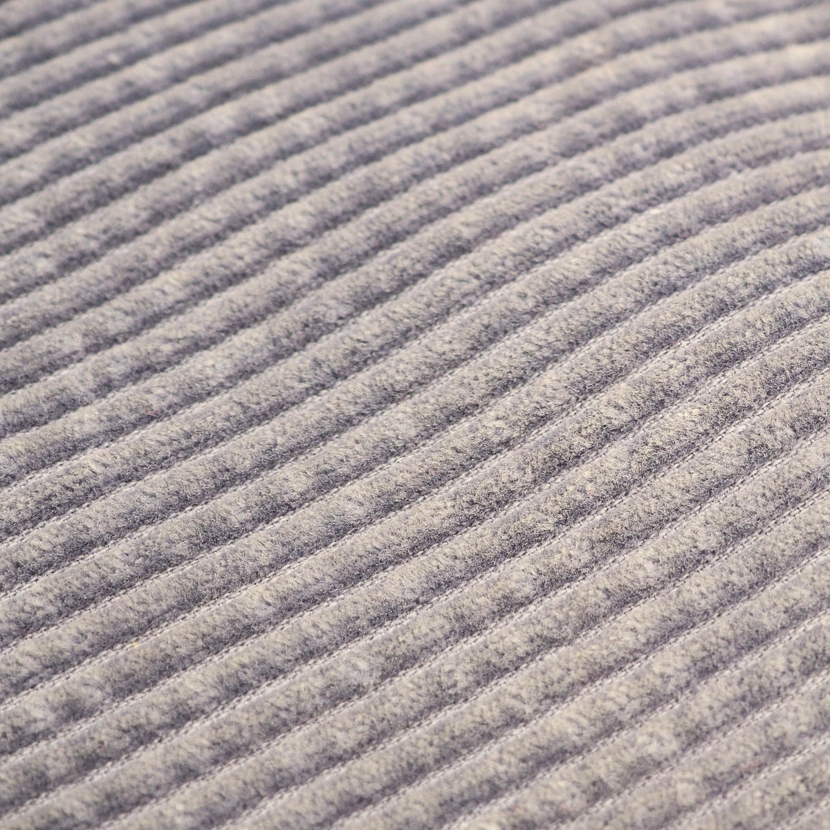 Close-up of a ribbed fabric texture in a heathered gray color, showing the detailed knit pattern.