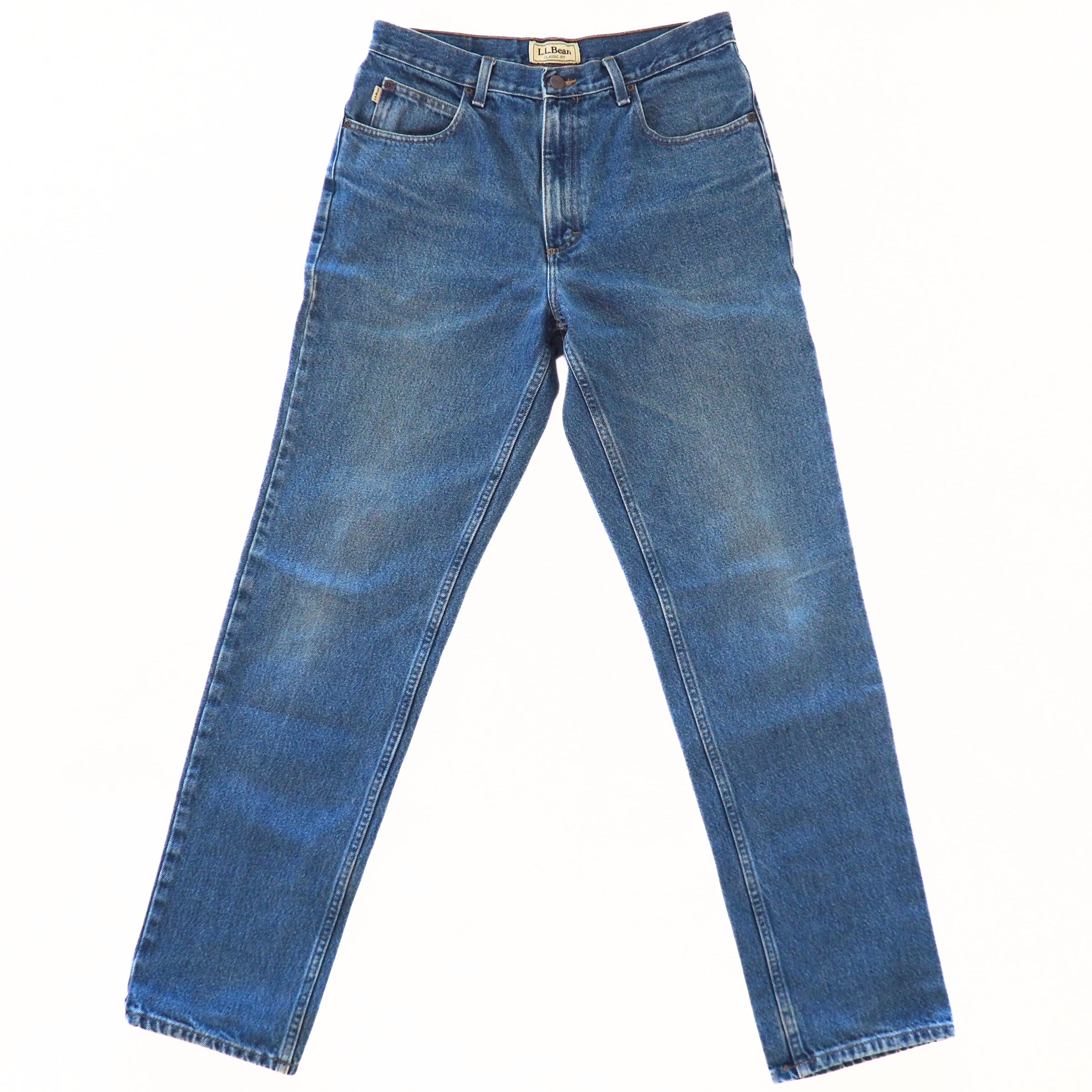 Front view of a pair of blue jeans on a white background