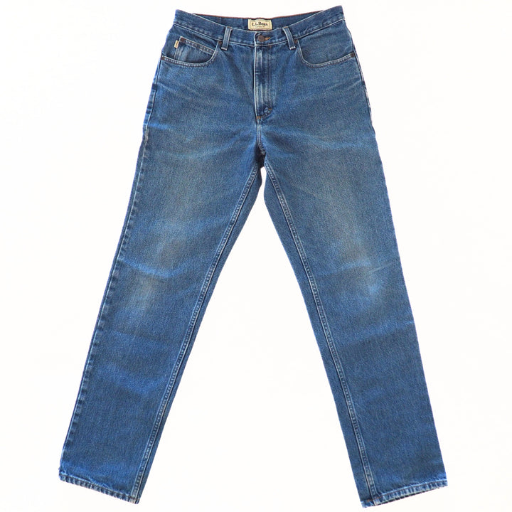 Front view of a pair of blue jeans on a white background