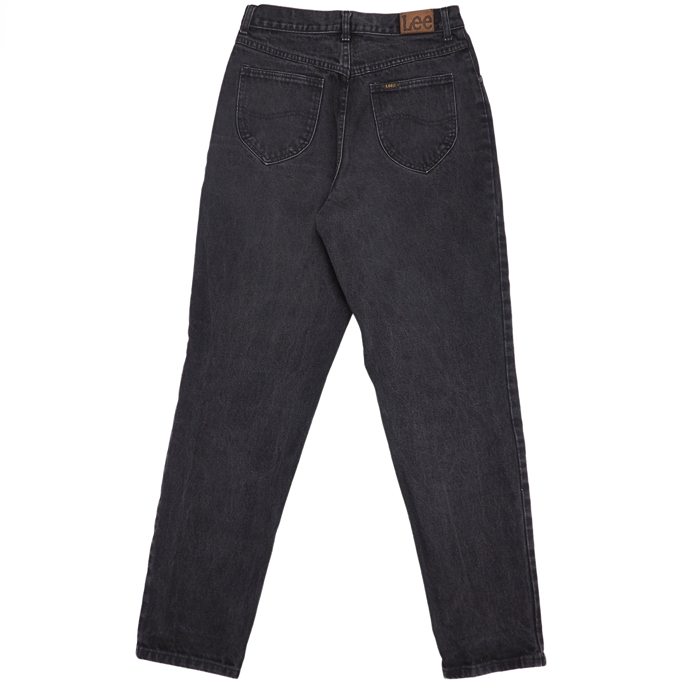 Rear view of a pair of black denim jeans with leather 'Lee' jacron patch on a white background